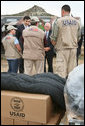 Vice President Dick Cheney and Georgian President Mikheil Saakashvili speak with USAID workers Thursday, Sept. 4, 2008 at a relief operation center at Tbilisi International Airport. The Vice President's visit comes a day after an announcement for plans to deliver a $1 billion U.S. humanitarian and economic aid package to Georgia in response to the recent conflict with Russia. White House photo by David Bohrer