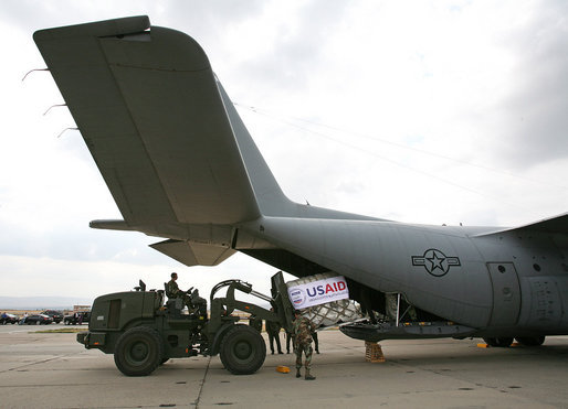 A U.S. Army crew offloads USAID humanitarian supplies from a C-130 aircraft Thursday, Sept. 4, 2008 during a visit by Vice President Dick Cheney to a U.S. relief operation center at Tbilisi International Airport, Georgia. Through U.S. relief efforts, Georgians affected by the recent Russian aggression are receiving cots, blankets, food rations and hygiene packs. White House photo by David Bohrer