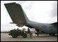 A U.S. Army crew offloads USAID humanitarian supplies from a C-130 aircraft Thursday, Sept. 4, 2008 during a visit by Vice President Dick Cheney to a U.S. relief operation center at Tbilisi International Airport, Georgia. Through U.S. relief efforts, Georgians affected by the recent Russian aggression are receiving cots, blankets, food rations and hygiene packs. White House photo by David Bohrer