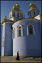 A member of the clergy walks past the gold-domed St. Michael's Monastery in the early morning light of Friday, Sept. 5, 2008 in Kyiv, where Vice President Dick Cheney is currently visiting during a multi-day tour of ex-Soviet republics. The monastery, originally constructed in the 12th century, is named after the Archangel Michael, patron saint of Kyiv, and was destroyed by Soviet communists between 1934-36 and reconstructed in 2000. White House photo by David Bohrer