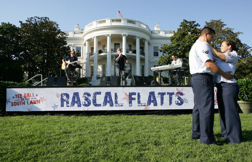 A couple dances as the The Rascal Flatts entertain guests on the South Lawn of the White House following the Tee Ball on the South Lawn: A Salute to the Troops game Sunday, Sept. 7, 2008 at the White House. The Tee Ball game was played by the children of active-duty military personnel in honor of the nation's military personnel. White House photo by Chris Greenberg