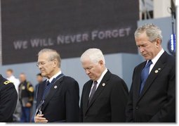 President George W. Bush is joined by former Secretary of Defense Donald Rumsfeld, left, and U.S. Secretary of Defense Robert Gates, as they bow their heads during a moment of silence Thursday, Sept. 11, 2008, during the dedication of the 9/11 Pentagon Memorial at the Pentagon in Arlington, Va. White House photo by Eric Draper