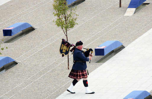 A bagpiper plays as he walks through the 9/11 Pentagon Memorial Thursday, Sept. 11, 2008, during the dedication ceremony of the 9/11 Pentagon Memorial at the Pentagon in Arlington, Va. White House photo by Chris Greenberg