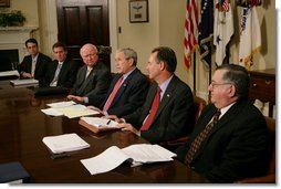 President George W. Bush is joined by Secretary of Energy Samuel Bodman, (third from left), FEMA Administrator David Paulison, (second from right), and Deputy Secretary for the Department of Homeland Security Paul Schneider, right, as he speaks to the press from the Roosevelt Room following a briefing on the latest developments concerning Hurricane Ike, Sunday, Sept. 14, 2008. White House photo by Chris Greenberg