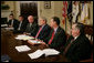 President George W. Bush is joined by Secretary of Energy Samuel Bodman, (third from left), FEMA Administrator David Paulison, (second from right), and Deputy Secretary for the Department of Homeland Security Paul Schneider, right, as he speaks to the press from the Roosevelt Room following a briefing on the latest developments concerning Hurricane Ike, Sunday, Sept. 14, 2008. White House photo by Chris Greenberg