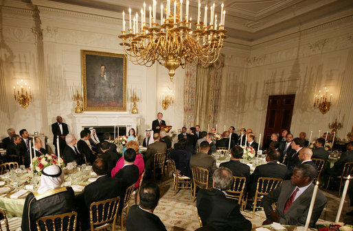 President George W. Bush welcomes guests to the Iftaar Dinner with Ambassadors and Muslim leaders in the State Dining Room of the White House, Thursday, Sept. 17, 2008, to celebrate the traditions of Islamic faith and culture. White House photo by Chris Greenberg