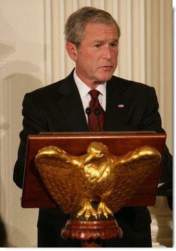 President George W. Bush welcomes guests to the Iftaar Dinner with Ambassadors and Muslim leaders in the State Dining Room of the White House, Thursday, Sept. 17, 2008, to celebrate the traditions of Islamic faith and culture. White House photo by Chris Greenberg