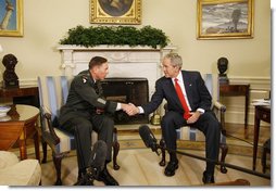 President George W. Bush and U.S. Army General David Petraeus, former Commander of the Multi-National Force in Iraq, shakehands Wednesday, Sept. 17, 2008, in the Oval Office at the White House. In speaking to reporters President Bush honored and congratulated General Petraeus for his outstanding command leadership in Iraq, and thanked him for agreeing to be the new commander of CENTCOM. White House photo by Eric Draper