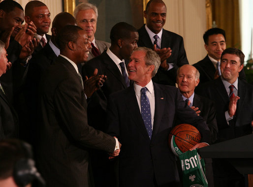 President George W. Bush shakes hands with Paul Pierce, team captain of the Boston Celtics, after Pierce presented him with a signed basketball and jersey Friday, Sept. 19, 2008, on behalf of the 2008 NBA Championship team. Pierce used the occasion of the team's visit to the White House to announce its donation of $100,000 to the American Red Cross to aid those affected by Hurricane Ike. White House photo by Joyce N. Boghosian