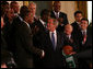 President George W. Bush shakes hands with Paul Pierce, team captain of the Boston Celtics, after Pierce presented him with a signed basketball and jersey Friday, Sept. 19, 2008, on behalf of the 2008 NBA Championship team. Pierce used the occasion of the team's visit to the White House to announce its donation of $100,000 to the American Red Cross to aid those affected by Hurricane Ike. White House photo by Joyce N. Boghosian