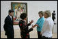 Mrs. Laura Bush stops in front of Pablo Picasso's painting 'Nude Man and Woman' as she is given a tour of the Nasher Sculpture Center by Acting Chief Curator Jed Morse, left, Trustee Nancy Nasher, gesturing, and Debbie Francis, right, Friday, Sept. 19, 2008 , in Dallas. White House photo by Chris Greenberg