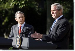 President George W. Bush gestures as he delivers his remarks during a joint press availability with Colombian President Alvaro Uribe Saturday, Sept. 20, 2008, in the Rose Garden at the White House. White House photo by Eric Draper