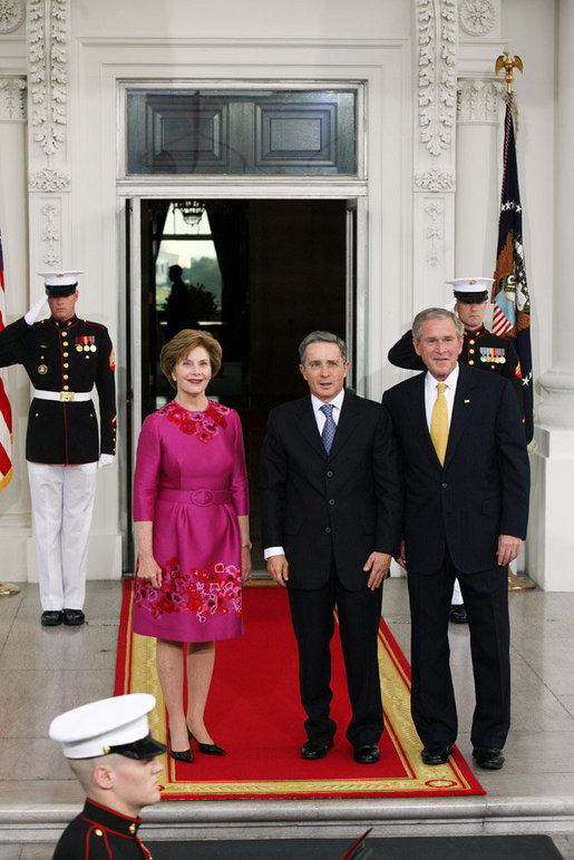 President George W. Bush and Mrs. Laura Bush greet Colombian President Alvaro Uribe on the North Portico Saturday, Sept. 20, 2008, for a social dinner at the White House. White House photo by Joyce N. Boghosian