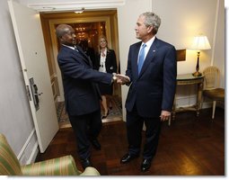 President George W. Bush greets Uganda's President Yoweri Museveni Tuesday, Sept. 23, 2008, at The Waldorf-Astoria Hotel in New York. President Bush thanked his counterpart for implementing the Malaria Initiative and said, "There's been over 200,000 bed nets distributed in your country, Mr. President, and that's because of the leadership of you and the organization of your government." White House photo by Eric Draper