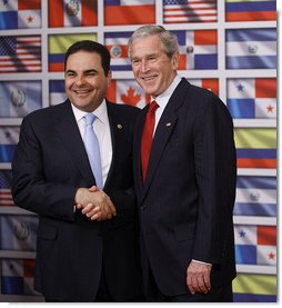 President George W. Bush shakes hands with President Antonio Saca of El Salvador after delivering a statement on temporary protected status during a visit by President Bush Wednesday, Sept. 24, 2008, to the Council of the Americas. Said President Bush, "I want to let my friend know, and the people of El Salvador, that the United States will extend TPS status to El Salvadoreans living in our country. I'm proud to make this announcement with you standing by my side."  White House photo by Eric Draper