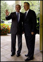 President George W. Bush and former President George H.W. Bush pause to acknowledge staff as they depart the Oval Office Thursday, Sept. 25, 2008, after the signing of S.3406, the ADA Amendments Act of 2008. White House photo by Joyce N. Boghosian