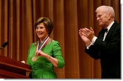 Mrs. Laura Bush is honored with the Living Legend Medallion by Dr. James Billington, the Librarian of Congress, Friday evening, Sept. 26, 2008 in Washington, D.C., during the 2008 National Book Festival Gala Performance.  White House photo by Joyce N. Boghosian