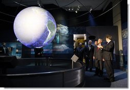 President George W. Bush views a display in the new Sant Ocean Hall as he is escorted by Christian Samper, Director of the Smithsonian Museum of Natural History, right, Friday, Sept. 26, 2008, during his visit to the Smithsonian Museum of Natural History in Washington, D.C. White House photo by Eric Draper