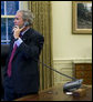 President George W. Bush places phone calls to Congressional members Friday, Sept. 26, 2008, from the Oval Office of the White House as negotiations continued on the financial rescue package. White House photo by Eric Draper