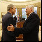 President George W. Bush and President Valdus Adamkus share a moment in the Oval Office Monday, Sept. 29, 2008, during the Lithuanian leader's visit to the White House. White House photo by Eric Draper