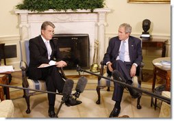 President George W. Bush listens as Ukraine's President Viktor Yushchenko addresses reporters during their meeting in the Oval Office at the White House, Monday, Sept. 29, 2008. White House photo by Eric Draper