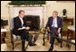 President George W. Bush listens as Ukraine's President Viktor Yushchenko addresses reporters during their meeting in the Oval Office at the White House, Monday, Sept. 29, 2008. White House photo by Eric Draper