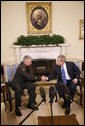 President George W. Bush welcomes General David D. McKiernan, Commander for NATO International Security Assistance Force in Afghanistan, to the Oval Office Wednesday, Oct. 1, 2008. White House photo by Eric Draper