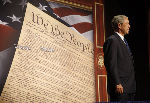 President George W. Bush acknowledges the applause of the audience at his introduction to address a legal conference on judicial accomplishments and philosophy Monday, Oct. 6, 2008, in Cincinnati. White House photo by Eric Draper