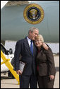 President George W. Bush embraces Freedom Corps greeter Nancy Arnold of Fairfield, Ohio, who President Bush honored with a Presidental Volunteer Service Award upon his arrival to Cincinnati/Northern Kentucky International Airport Monday, Oct. 6, 2008, in Hebron, Ky. White House photo by Eric Draper