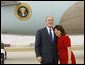 President George W. Bush hugs Freedom Corps greeter Sonya McDonald upon his arrival Monday, Oct. 6, 2008, in San Antonio, Texas. In January 2006, while her husband was deployed to Iraq, Mrs. McDonald spearheaded a fundraising effort to benefit Fisher House. Her goal was to raise $200,000 between Memorial Day and Independence Day 2006. She developed and implemented a marketing plan and solicited help from local businesses and organizations to generate donations. White House photo by Eric Draper