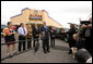 President George W. Bush and Mrs. Laura Bush are joined by local small business leaders for remarks on the economy Monday, Oct. 6, 2008, outside Olmos Pharmacy in San Antonio, Texas. White House photo by Eric Draper