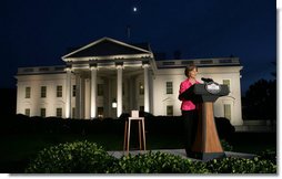 Mrs. Laura Bush prepares to push the button, Oct. 7, 2008, to light up the White House in a pink glow as part of Breast Cancer Awareness. Preventing and curing breast cancer is a cause that Mrs. Bush has worked toward around the world.  White House photo by Chris Greenberg