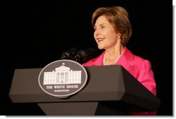 Mrs. Bush addresses a group gathered for the lighting of the White House, Oct. 7, 2008, in the color pink in honor of Breast Cancer Awareness Month. Mrs. Bush thanked the researchers, doctors, advocates and others who have worked to fight the disease that is the leading cause of death in women. Mrs. Bush has worked to make the fight on cancer and cancer prevention a global effort.  White House photo by Chris Greenberg