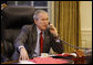 President George W. Bush speaks on the phone in the Oval Office Tuesday, Oct. 7, 2008, with Prime Minister Gordon Brown of the United Kingdom, discussing efforts to solve the spreading global financial crisis. President Bush also held phone conversations with French President Nicolas Sarkozy and Italian Prime Minister Silvio Berlusconi. White House photo by Eric Draper