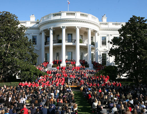 President George W. Bush joined by Mrs. Laura Bush receives applause during his remarks to the members of the 2008 United States Summer Olympic and Paralympic Teams Tuesday, Oct. 7, 2008, on the South Lawn of the White House. President Bush said, "You amazed the world with your talent and grace and sportsmanship. You inspired children to chase their dreams. You will be champions forever." White House photo by Joyce N. Boghosian