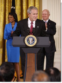 President George W. Bush welcomes guests to the East Room of the White House prior to signing H.R. 7081, The United States-India Nuclear Cooperation Approval and Nonproliferation Enhancement Act, Wednesday, Oct. 8, 2008, in the East Room at the White House. White House photo by Eric Draper