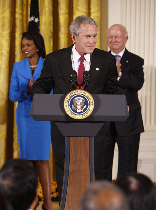 President George W. Bush welcomes guests to the East Room of the White House prior to signing H.R. 7081, The United States-India Nuclear Cooperation Approval and Nonproliferation Enhancement Act, Wednesday, Oct. 8, 2008, in the East Room at the White House. White House photo by Eric Draper