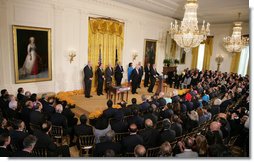 President George W. Bush addresses his remarks prior to signing H.R. 7081, The United States-India Nuclear Cooperation Approval and Nonproliferation Enhancement Act, Wednesday, Oct. 8, 2008, in the East Room at the White House. President Bush is joined on stage by, from left, Rep. Joseph Crowley, D-N.Y., Rep. Eliot Engel, D-N.Y., Secretary of State Condoleezza Rice, Sen. Chris Dodd D-Conn., Senator John Warner of Virginia, Energy Secretary Samuel Bodman, India's Ambassador to the United States Ronen Sen and Vice President Dick Cheney. White House photo by Chris Greenberg