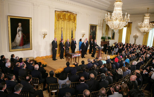 President George W. Bush addresses his remarks prior to signing H.R. 7081, The United States-India Nuclear Cooperation Approval and Nonproliferation Enhancement Act, Wednesday, Oct. 8, 2008, in the East Room at the White House. President Bush is joined on stage by, from left, Rep. Joseph Crowley, D-N.Y., Rep. Eliot Engel, D-N.Y., Secretary of State Condoleezza Rice, Sen. Chris Dodd D-Conn., Senator John Warner of Virginia, Energy Secretary Samuel Bodman, India's Ambassador to the United States Ronen Sen and Vice President Dick Cheney. White House photo by Chris Greenberg