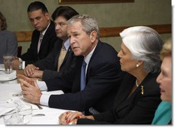 President George W. Bush speaks with reporters at the conclusion of his meeting with Cuban American community leaders Friday, Oct. 10, 2008, at Havana Harry's restaurant in Coral Gables, Fla. President Bush is flanked by Javier de Cespedes, president of Directorio Democratico and Sylvia Iriondo, right, president of Mothers and Women Against Repression (M.A.R.) Por Cuba. White House photo by Eric Draper