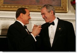 President George W. Bush and Italian Prime Minister Silvio Berlusconi raise their glasses in a toast Monday evening, Oct. 13, 2008, during a State Dinner in honor of Prime Minister Berlusconi's visit to the White House. White House photo by Joyce N. Boghosian