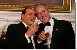 President George W. Bush and Italian Prime Minister Silvio Berlusconi raise their glasses in a toast Monday evening, Oct. 13, 2008, during a State Dinner in honor of Prime Minister Berlusconi's visit to the White House. White House photo by Joyce N. Boghosian