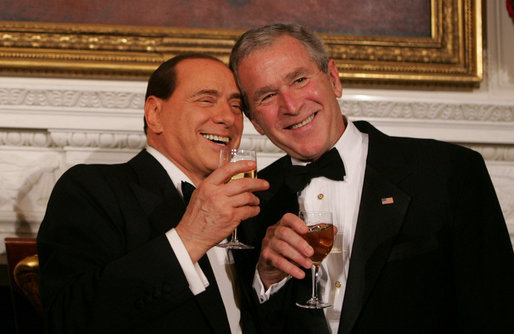 President George W. Bush and Italian Prime Minister Silvio Berlusconi raise their glasses in a toast Monday evening, Oct. 13, 2008, during a State Dinner in honor of Prime Minister Berlusconi's visit to the White House. White House photo by Joyce N. Boghosian