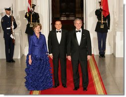 President George W. Bush and Mrs. Laura Bush welcome Italian Prime Minister Silvio Berlusconi Monday evening, Oct. 13, 2008, to the North Portico of the White House for a State Dinner in his honor. White House photo by Chris Greenberg