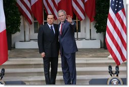 President George W. Bush and Italian Prime Minister Silvio Berlusconi stand together following their remarks at a joint press availability Monday, Oct. 13, 2008, at the White House. President Bush said, "I want to thank you for giving the American People the honor of celebrating Columbus Day with the leader of Italy." White House photo by Chris Greenberg