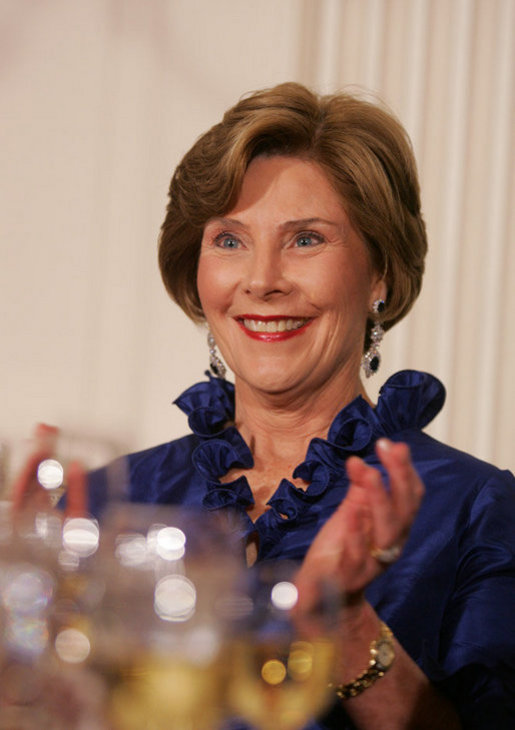 Mrs. Laura Bush applauds Italian Prime Minister Silvio Berlusconi as he his praised in an address by President George W. Bush Monday evening, Oct. 13, 2008, during the White House State Dinner in Berlusconi's honor. White House photo by Joyce N. Boghosian