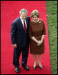 President George W. Bush and Mrs. Laura Bush stand together as they wait for the arrival of Prime Minister Silvio Berlusconi of Italy Monday, Oct. 13, 2008, during a South Lawn ceremony for the Prime Minister at the White House. White House photo by Grant Miller