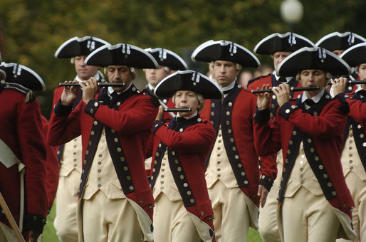 The Old Guard Fife and Drum Corps marches, Monday, Oct. 13, 2008, during the arrival ceremony of Italian Prime Minister Silvio Berlusconi to the White House. In support of the president, the Corps performs at all Armed Forces arrival ceremonies for visiting dignitaries and heads of state at the White House, and has participated in every Presidential Inaugural Parade since President John F. Kennedy's in 1961. White House photo by Andrew Hreha