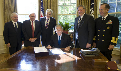 President George W. Bush is joined in the Oval Office Tuesday, Oct. 14, 2008, for the signing of S. 3001, the Duncan Hunter National Defense Authorization Act for Fiscal Year 2009. With him from left are: U.S. Secretary of Defense Robert Gates, U.S. Senator Carl Levin, D-Mich.; U.S. Senator John Warner, R-Va.; President Bush; Republican Congressman Duncan Hunter of California, and Admiral Mike Mullen, Chairman of the Joint Chiefs of Staff. White House photo by Joyce N. Boghosian