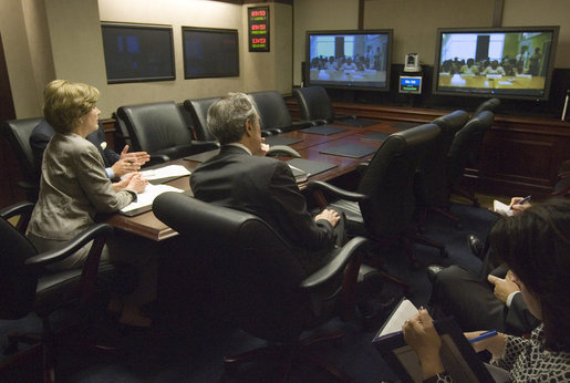 Joined by U.S. Secretary of Commerce Carlos Gutierrez, right, Mrs. Laura Bush talks with the Ladies in White via a video teleconference Thursday, Oct. 16, 2008, in the Situation Room of the White House. The Ladies in White is an organization that includes spouses and other relatives of jailed Cuban dissidents. The organization was formed in 2003 to protest the arrest of 75 dissidents by the Cuban regime. Members of the organization have been consistently detained, threatened, and at times beaten by police during their peaceful protests. White House photo by Joyce N. Boghosian